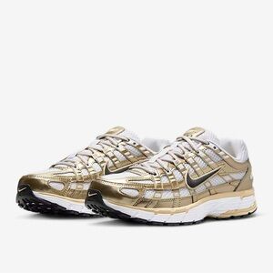 NIKE METALLIC GOLD P-6000. SIZE 7.5 WOMENS/6 MENS.